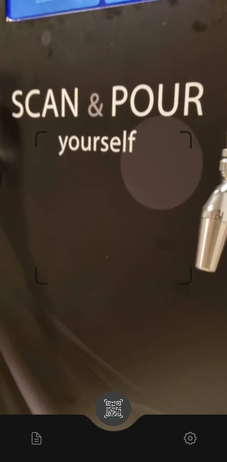 The customer app camera pointed at the machine QR code.