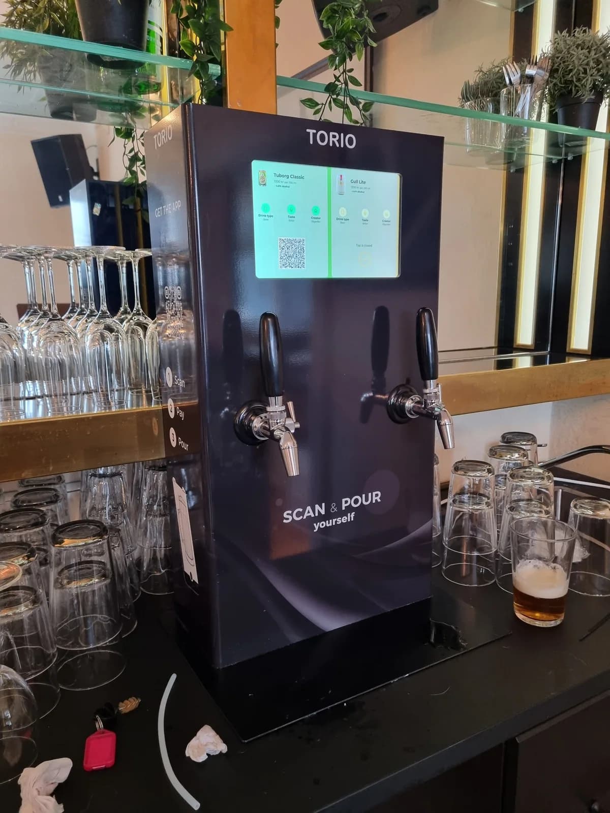 The finished PourSelf dispenser installed in a bar.