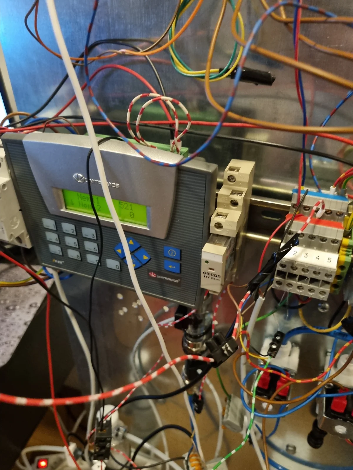 Machine control electronics and wiring during testing.