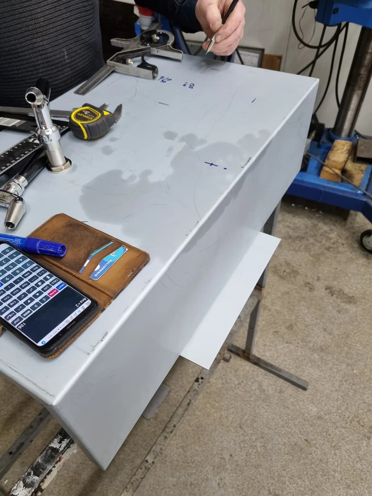 The machine enclosure under construction on a workshop bench.